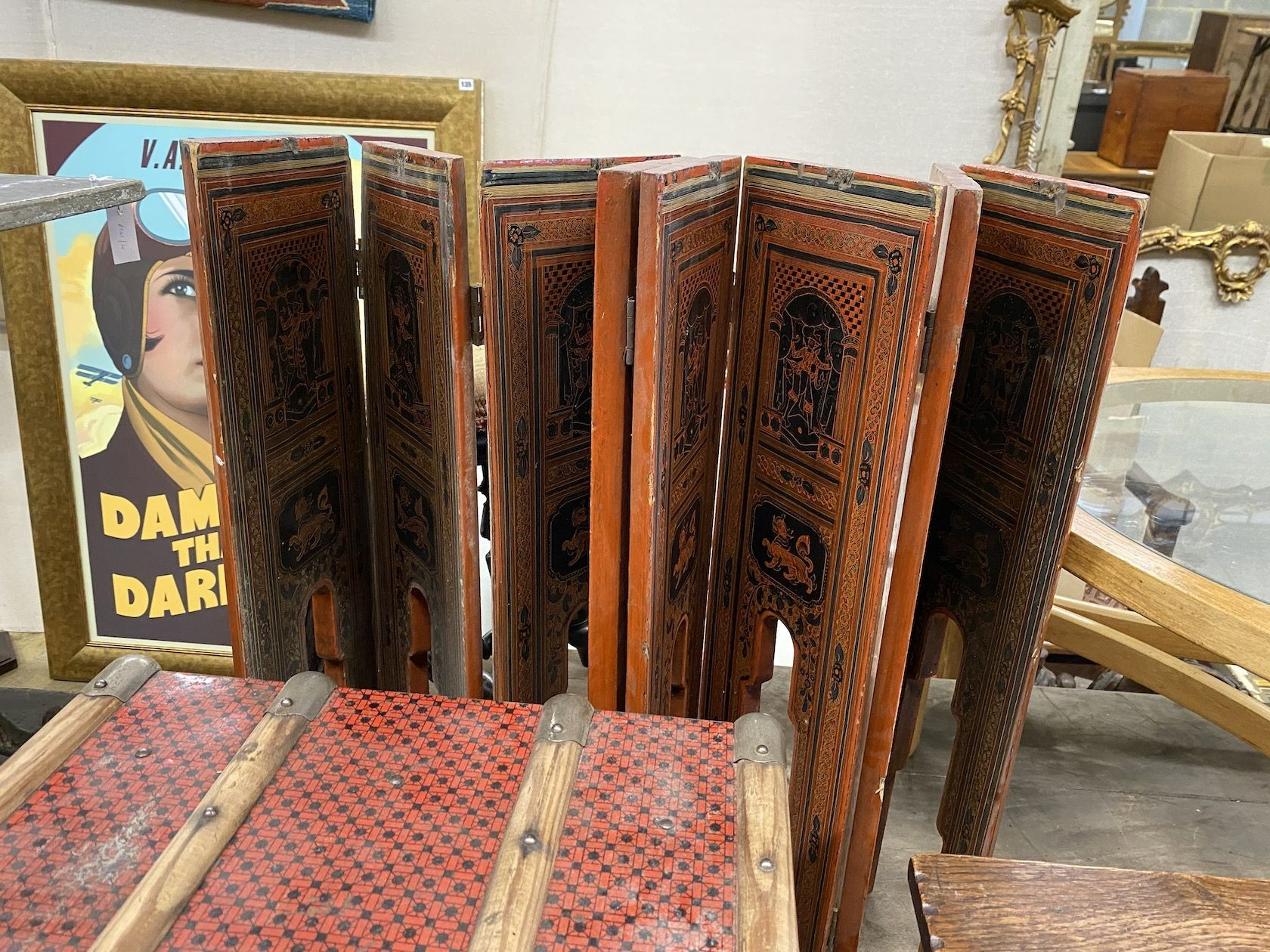 A Chinese lacquer eight fold table screen, height 67cm, an oak stool, and two engraved brass trays and a travelling trunk